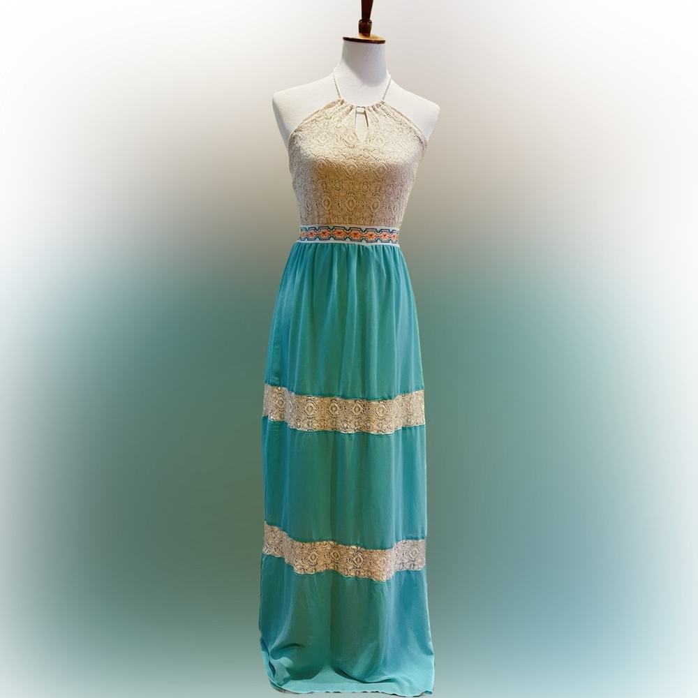 Teal and cream maxi dress with a crochet lace top that ties at the neck.